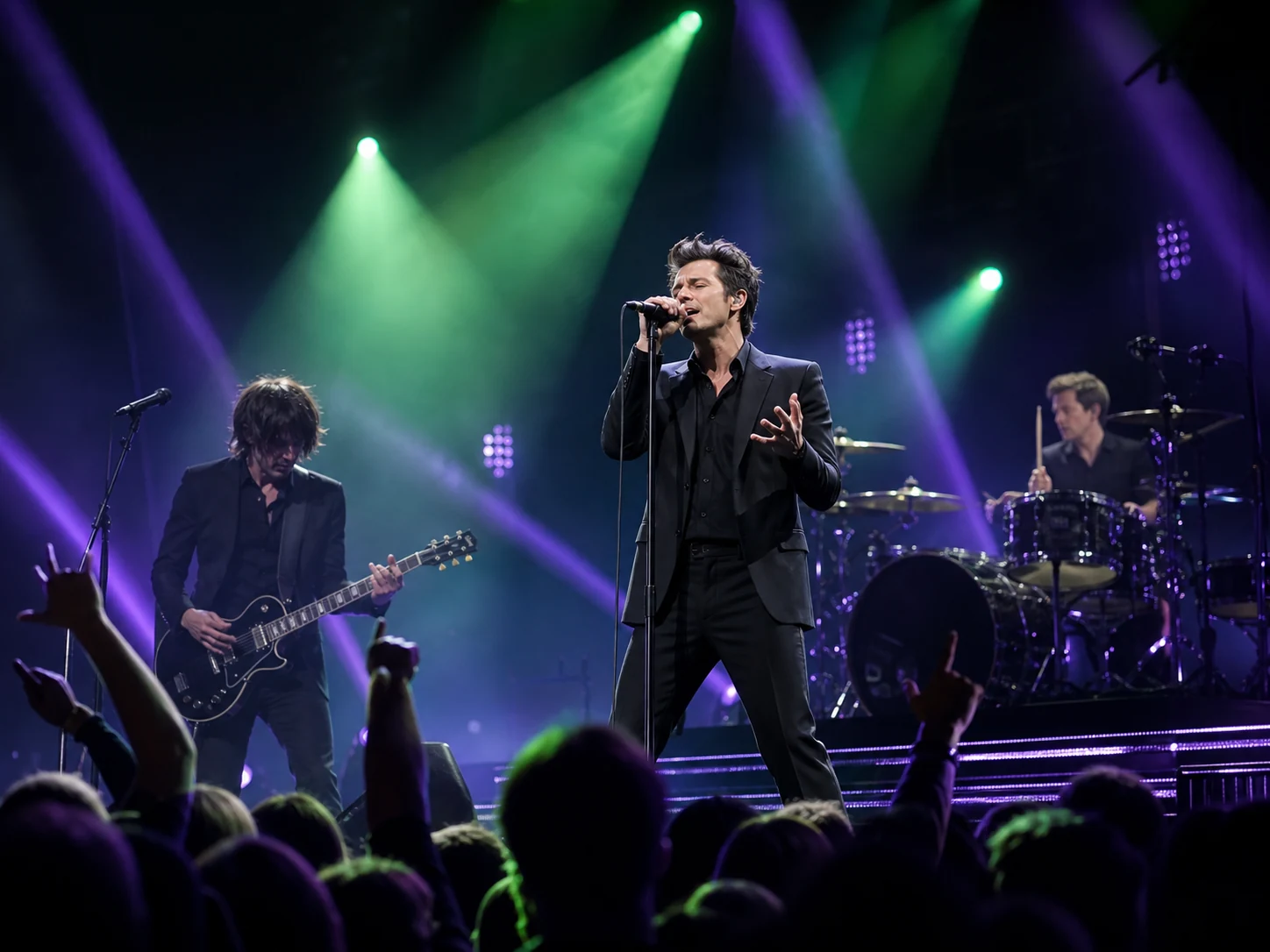 Singer and band performing under vivid concert lights